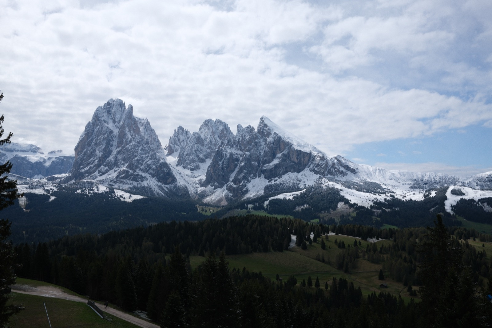 The Sassolungo group under fresh snow above the meadows of the Alpe di Siusi
