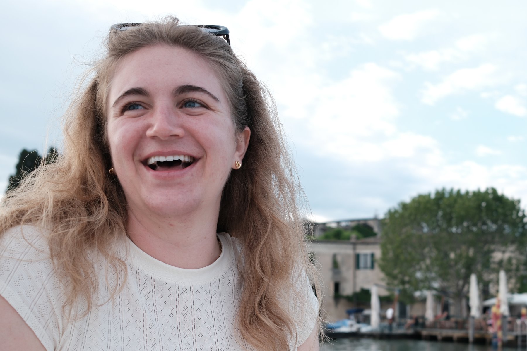 Laura Bleeke laughing on a boat on Lake Garda